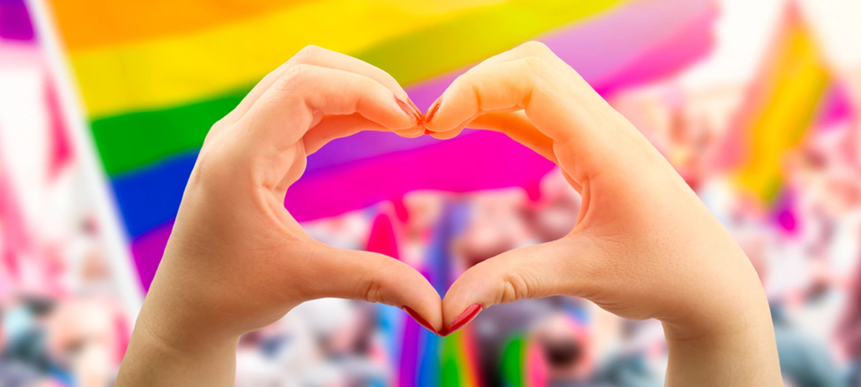 pride flag with heart hands